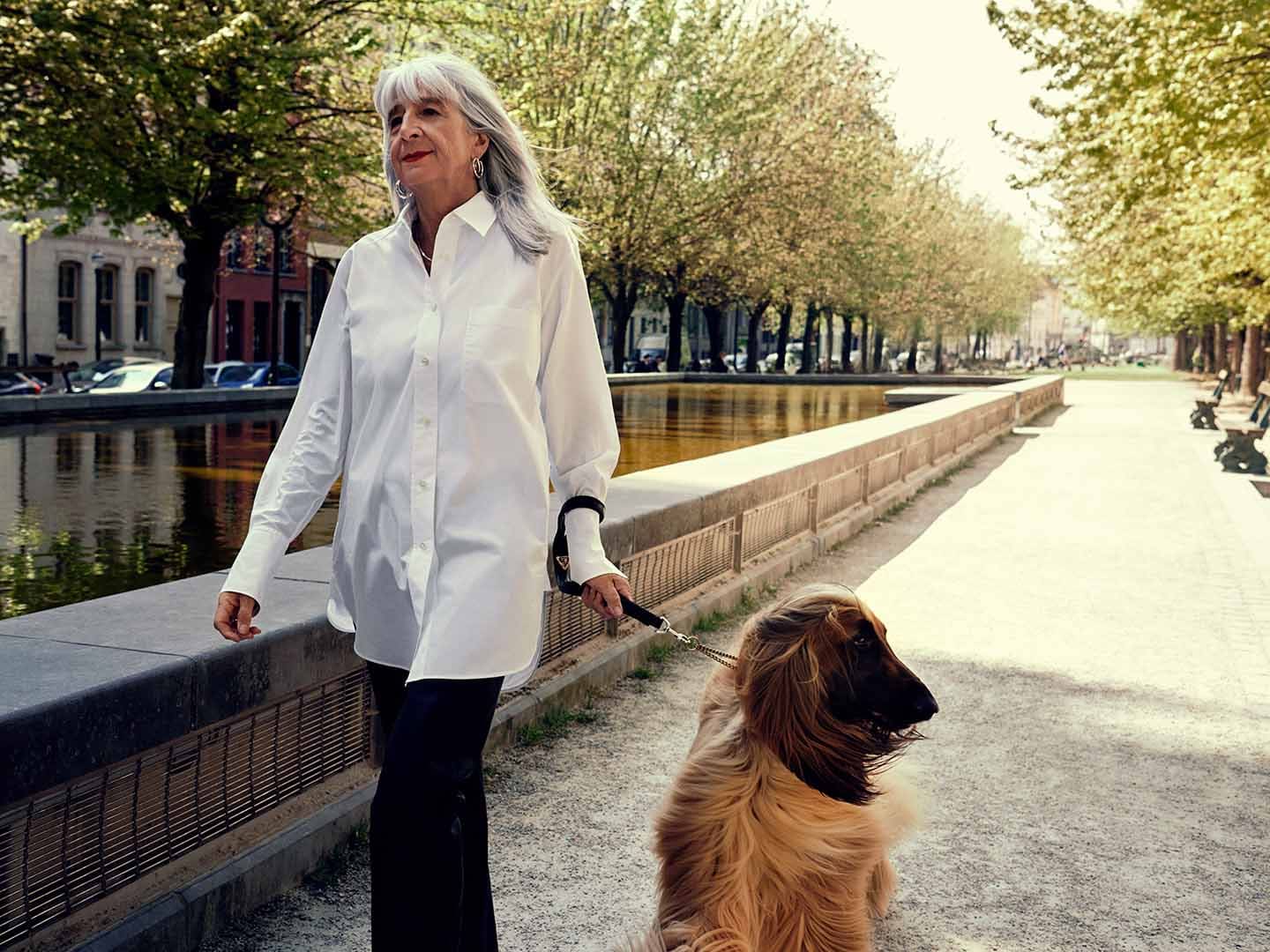Woman walking with dog outside